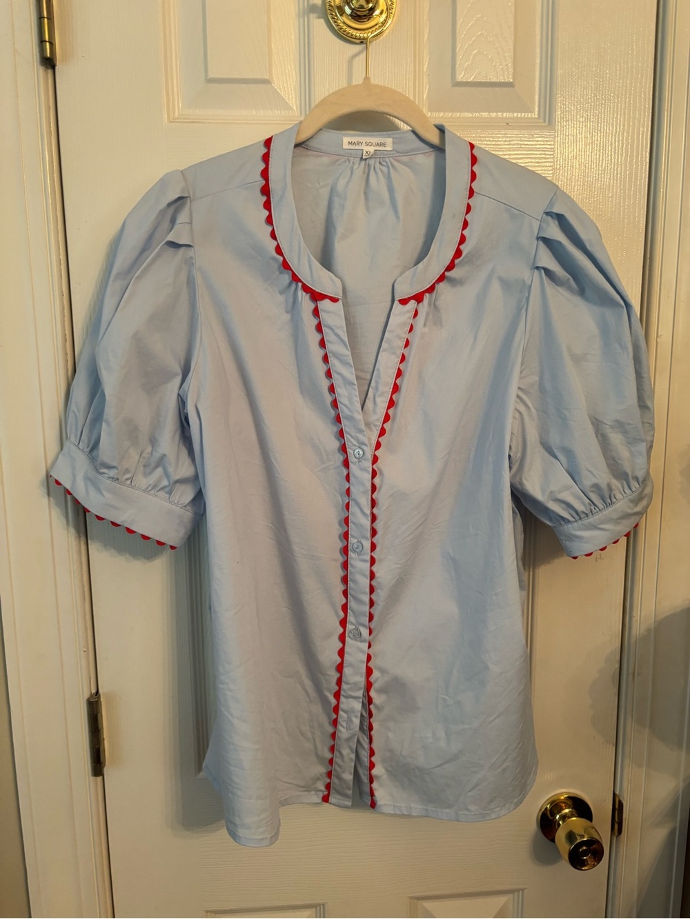NWOT. Mary Square Light Blue Puff Sleeve Blouse with Red Trim
